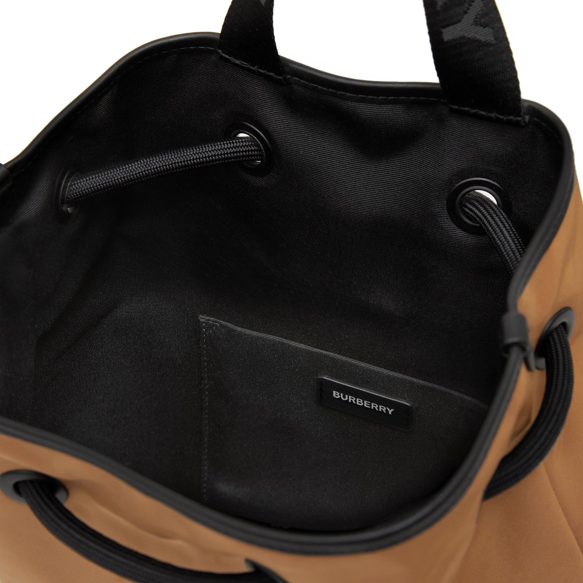 토마스 베어 프린트 나일론 드로스트링 백팩 베이지